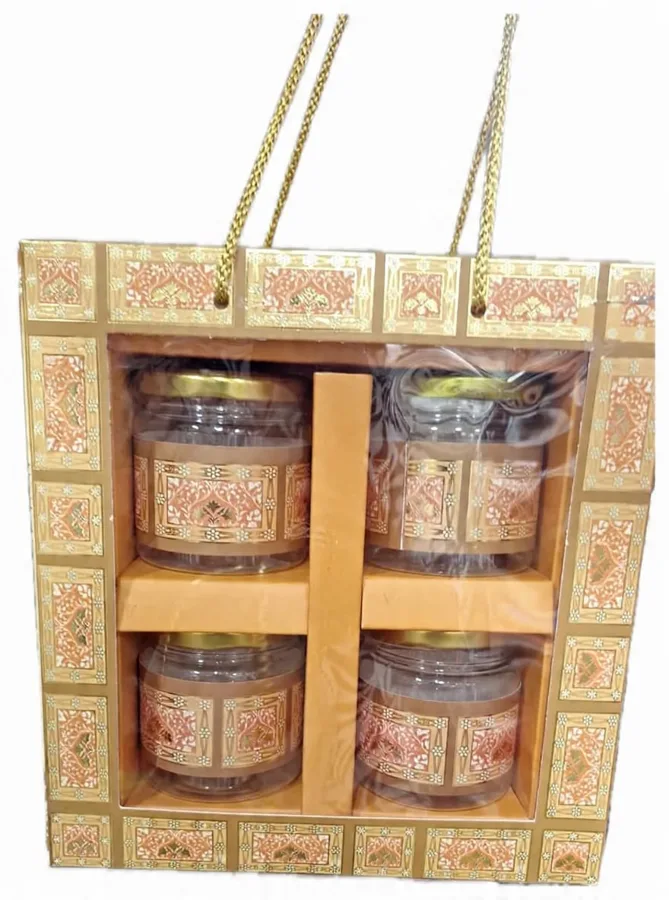 Gifting Box 3: gold patterned carry box with four jars behind a clear window
